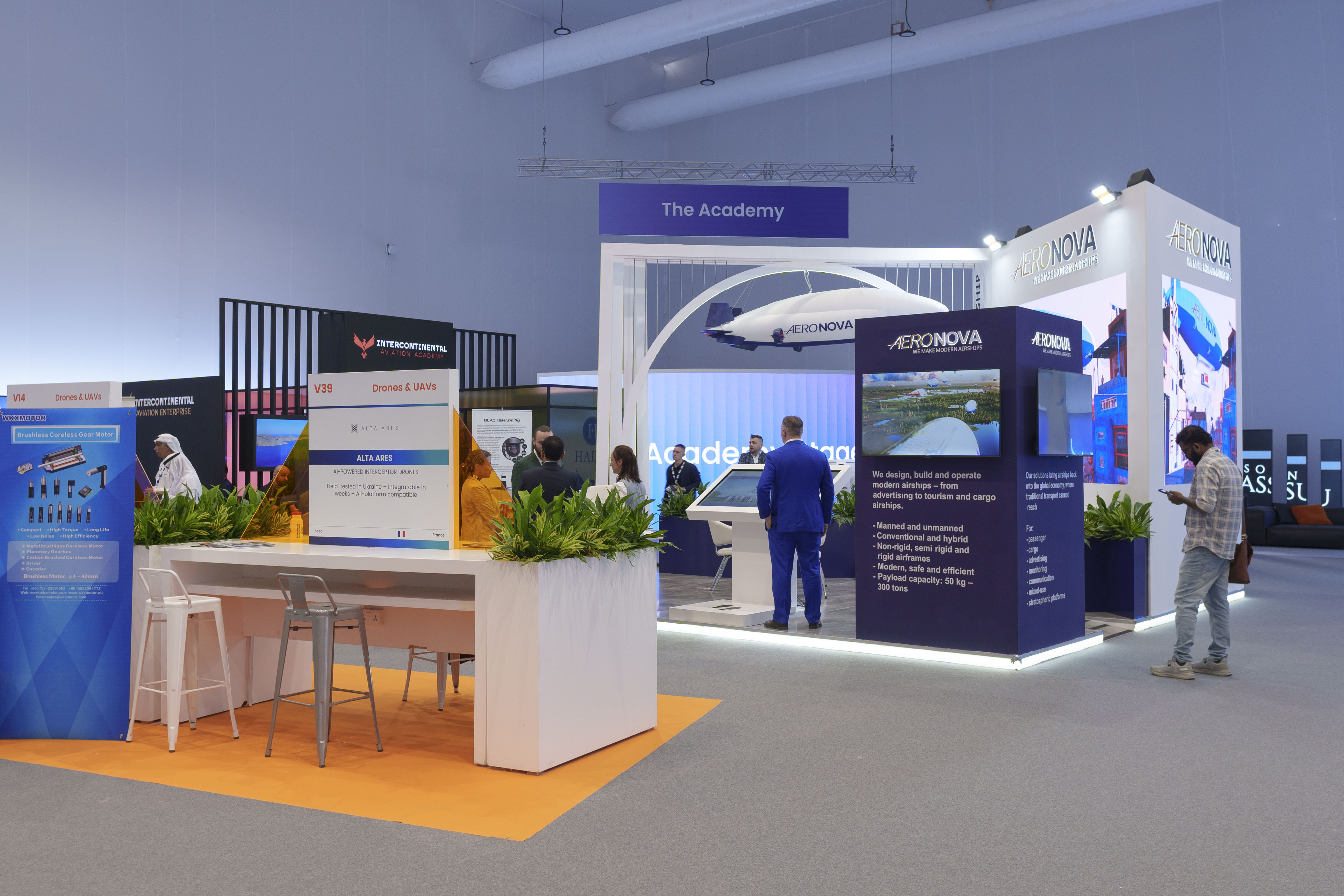 AERONOVA stand at the Dubai Airshow 2025 Vista pavilion · suspended airship model under the Academy arch