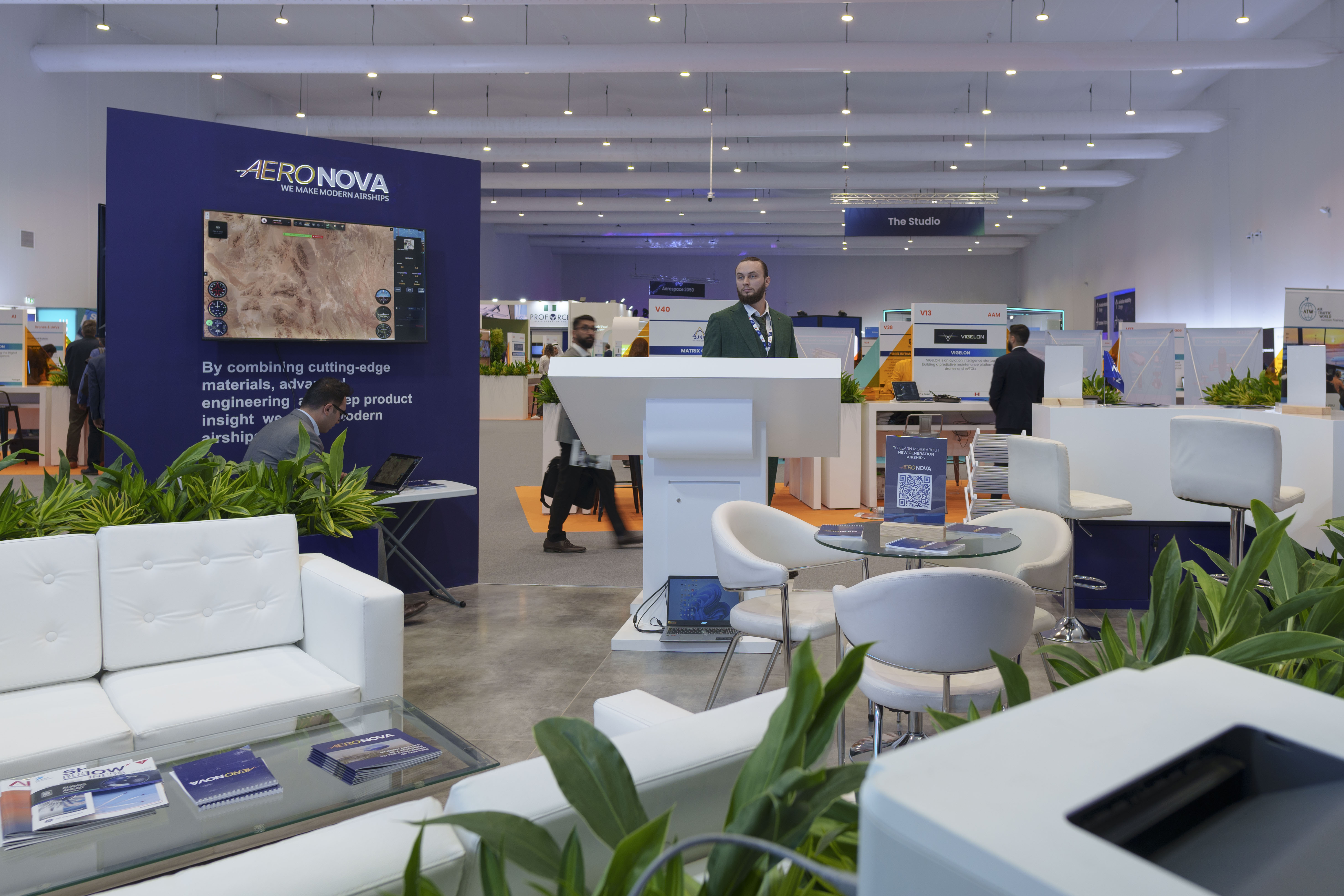 Stand interior · cutting-edge materials wall and meeting tables