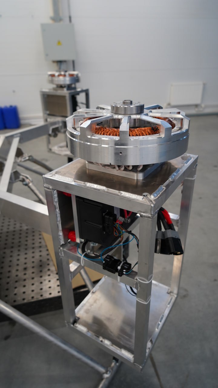 Slavyanka stator on aluminum test frame · second motor in the background