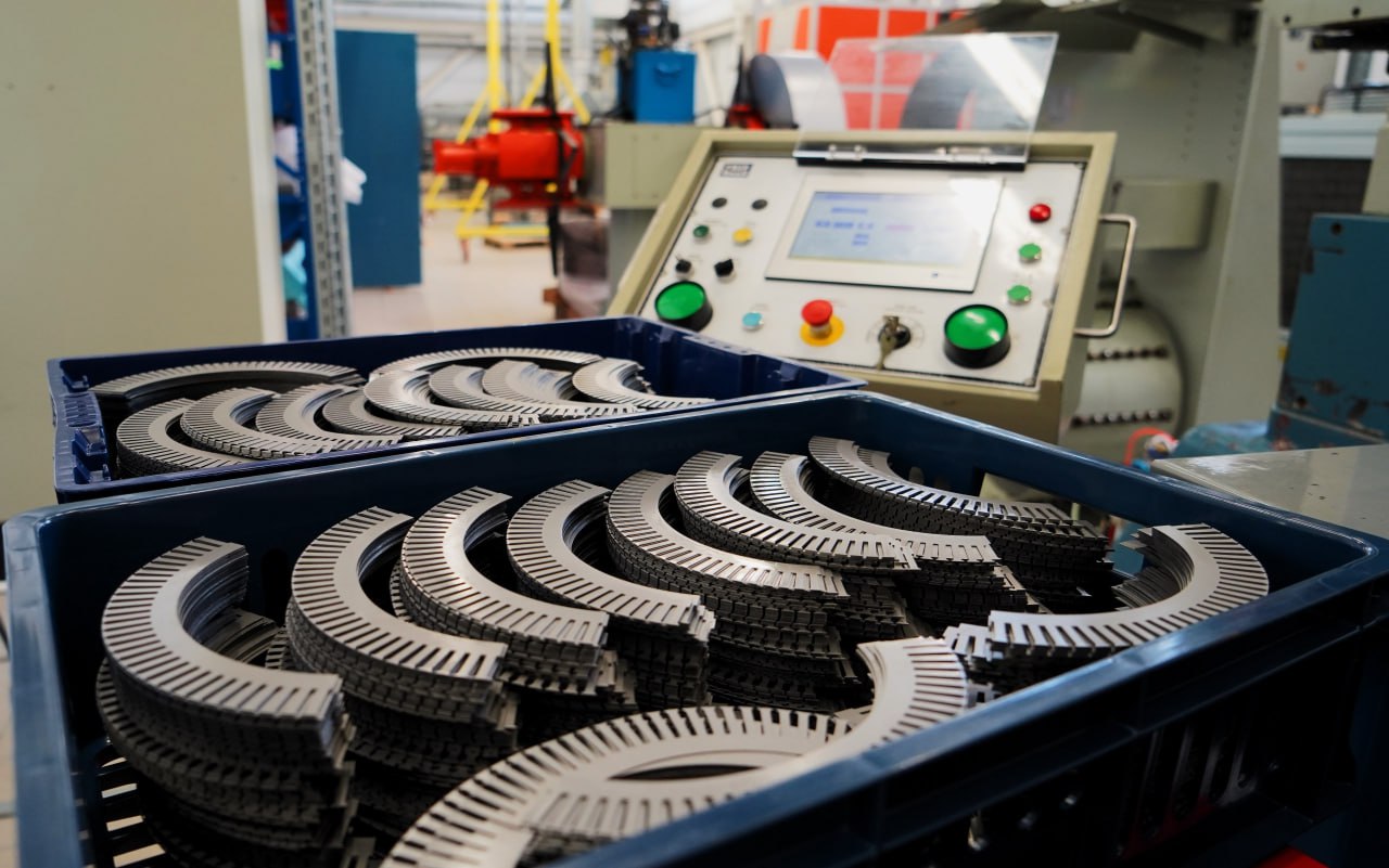 Finished stator cores from the stamping line (one every 15 seconds)