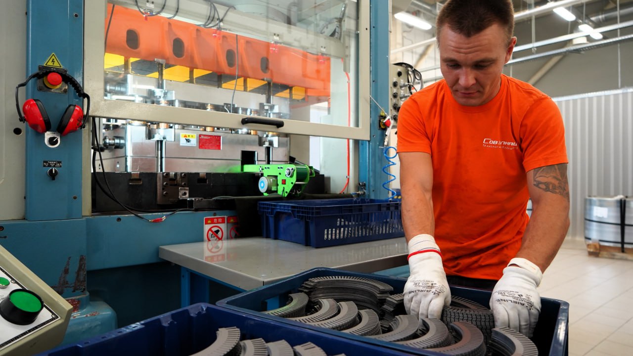 Sovelmash operator at the stamping press — stator core packages