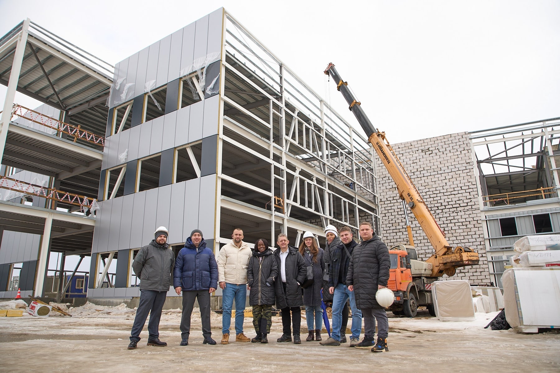 Gilles Weber and project partners at the Sovelmash construction site in February 2022.