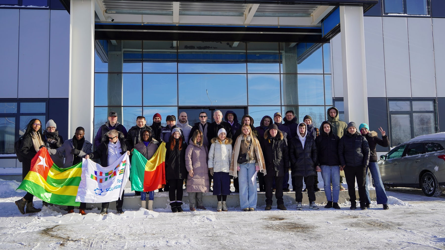 Investor and partner group photo outside the Sovelmash PKTB building.