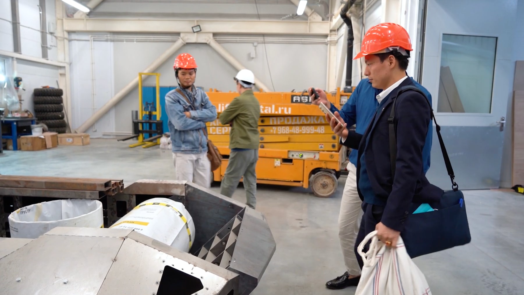 Delegation route through the production area and equipment zone.
